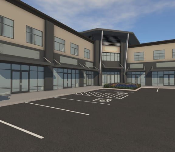 a large white building with a parking lot in front of it