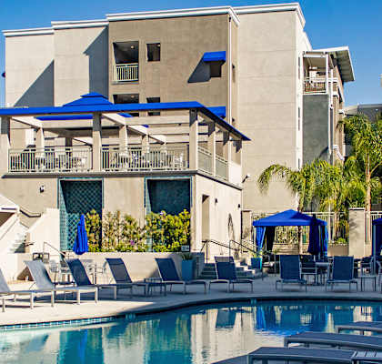 Gorgeous Swimming Pool with Blue Cabanas and Chaise Lounge Chairs at The Crossings at Redlands in Redlands, CA