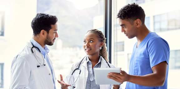 Three medical professionals at SoRoc On Maine, Rochester
