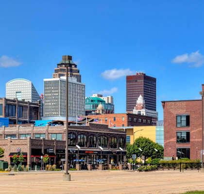 A cityscape with a mix of modern and older buildings.