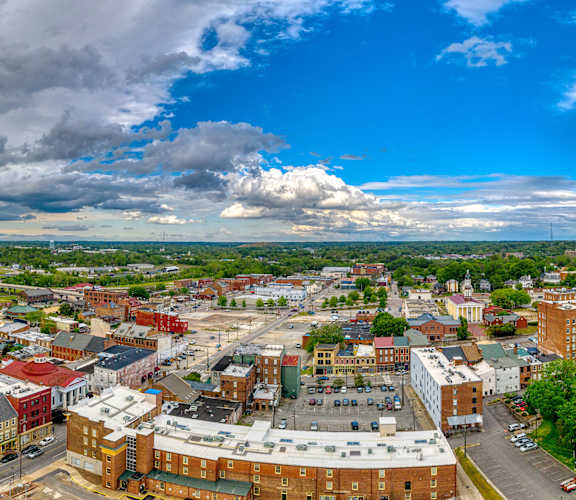 A cityscape with buildings and a cloudy sky.at The Residences at Southern Oaks, Petersburg Virginia