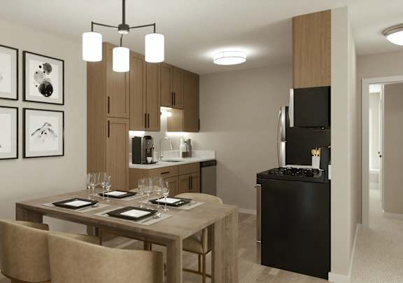 A modern kitchen with a dining table set for two.
