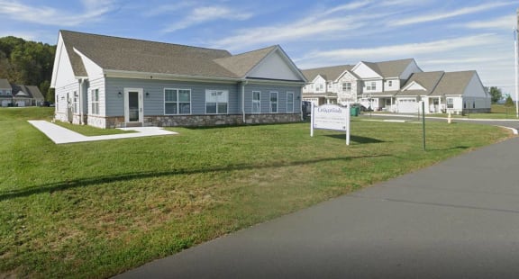 a sign in front of a row of houses