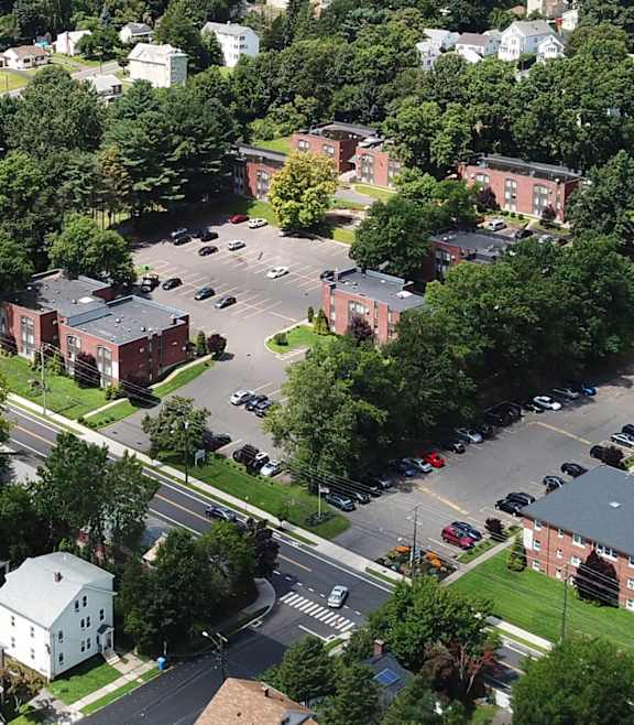 an aerial view of a parking lot in a city at Springwood Gardens, New Britain, CT, 06053