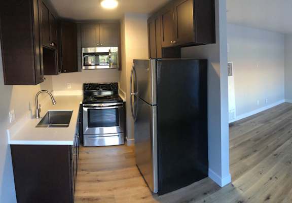 a kitchen and dining area in a 555 waverly unit