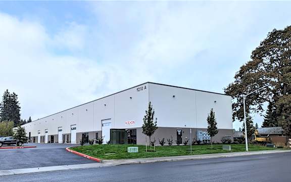 A large white building with the number 1201 A on it.