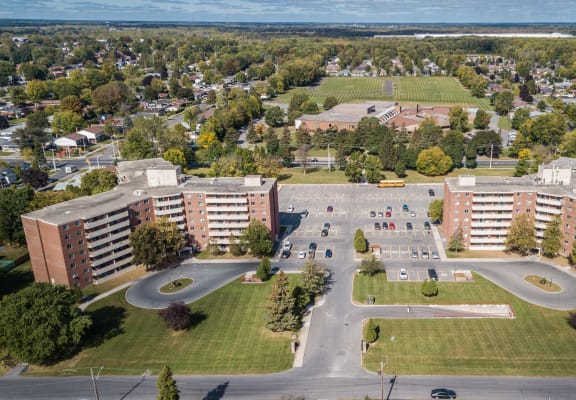 an aerial view of a city with buildings and a parking lot