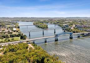 an aerial view of a bridge over a river