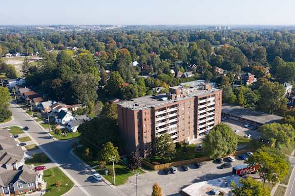 an aerial view of a tall building in a city