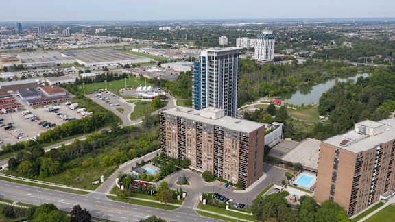 an aerial view of a city with tall buildings and a river