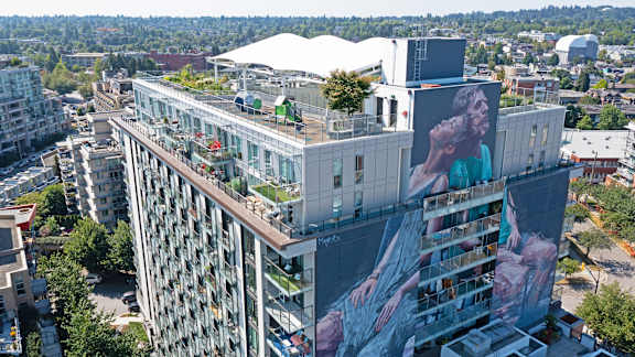 A large building with a mural on the side.