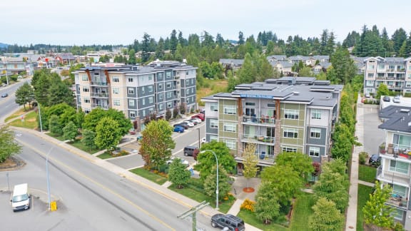 an aerial view of apartment buildings on a city street