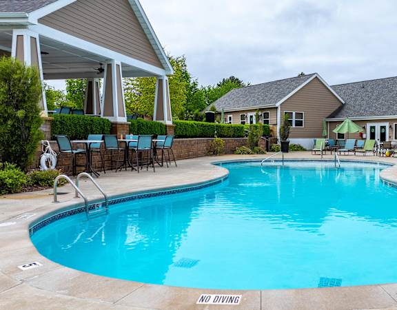 A pool with a no diving sign in the middle.