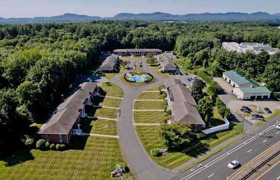 an aerial view of a community of buildings and a road at Hawkins Meadow in Amherst, MA, 01002
