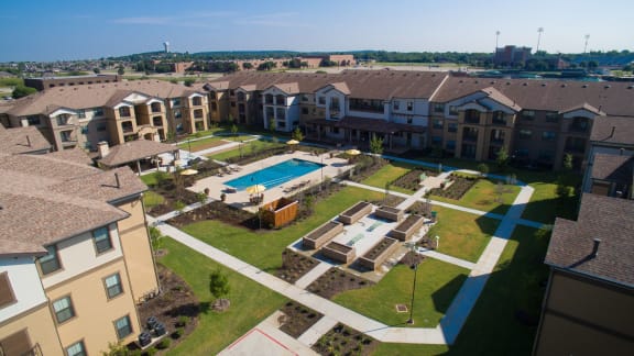 an aerial view of an apartment complex with a swimming pool at Mariposa at Elk Drive, Texas, 76028