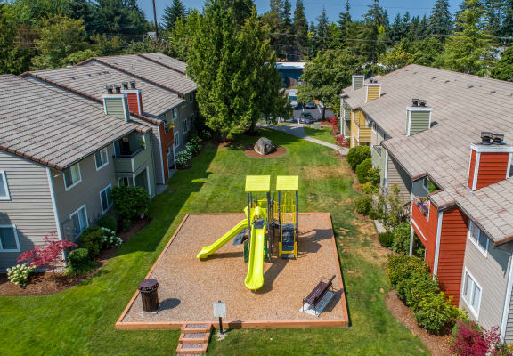 an aerial view of a yellow swing set in the courtyard at Quartz Creek, Washington