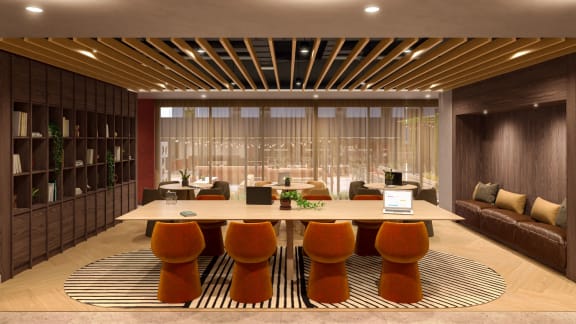 a large table and chairs in a room with a large window