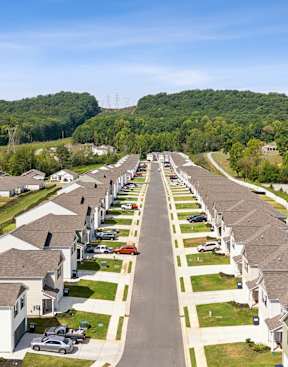 an aerial view of a neighborhood of houses and trees