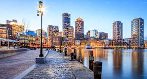 a view of the city skyline at dusk