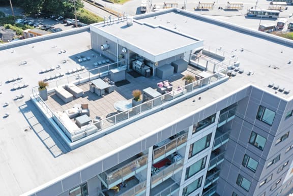 an aerial view of an apartment building with a rooftop terrace