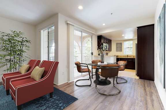 a living room with a table and chairs