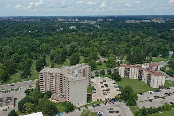 an aerial view of a building in a parking lot