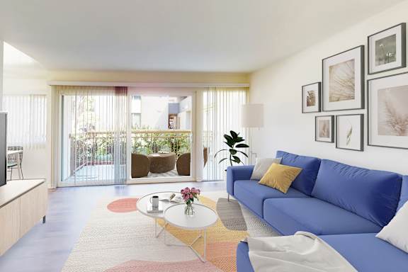 A living room with a blue couch and a television.