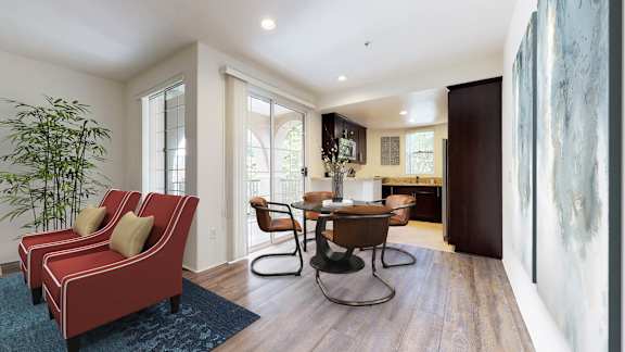 a living room with a table and chairs