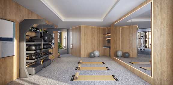 A yoga studio with wooden walls and a carpeted floor.