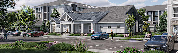 A modern house with a grey roof and white walls is surrounded by a grassy area and a parking lot with cars.