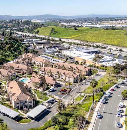 A bird's eye view of a residential area with houses and a road. at Whispering Fountains Diamond Bar, Diamond Bar, CA 91765