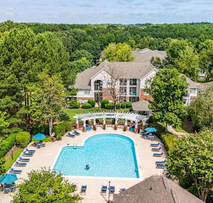 an aerial view of the pool at the resort on a sunny day