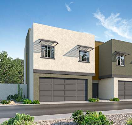 A modern two-story house with a garage on the ground floor.
