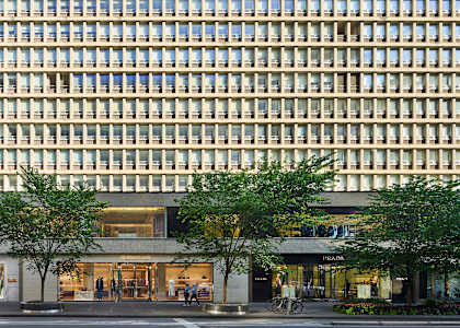 A large building with a flat roof and a lot of windows.