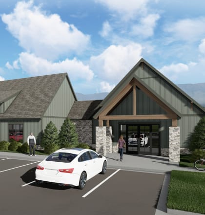 a rendering of a building with cars parked in front of it  at Alta25, Monument, CO