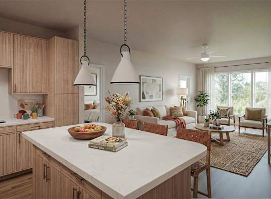 A kitchen with wooden cabinets and a white island with a book on it.