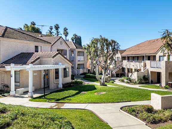A row of houses with a clear blue sky above them. at Whispering Fountains Diamond Bar, Diamond Bar California