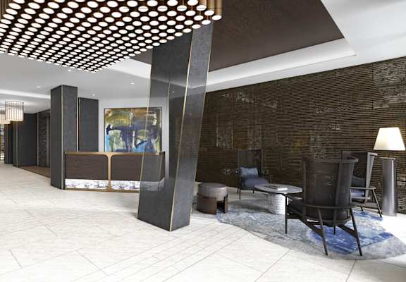 A modern living room with a stone wall and a wooden ceiling.