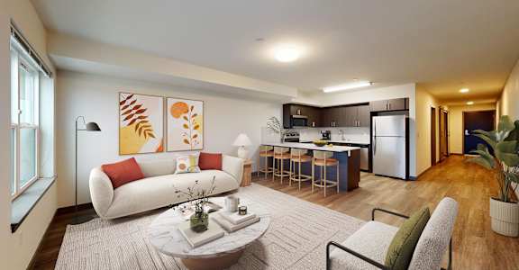A modern living room with a white sofa, a grey armchair, a coffee table, and a kitchen in the background.