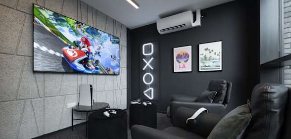 a living room with couches and a tv on the wall