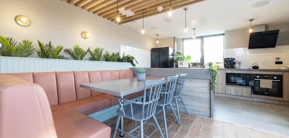 a dining room with a table and chairs