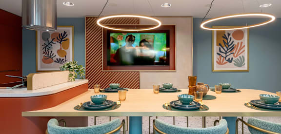 a dining room with a table and chairs