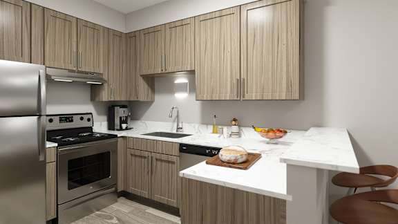 A modern kitchen with wooden cabinets and stainless steel appliances.
