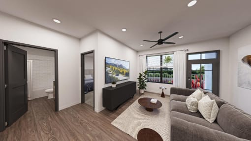 a living room with a couch and a ceiling fan  at Alta25, Monument, 80132