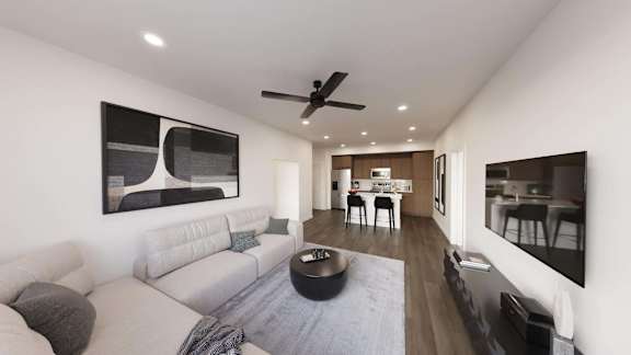 Living room with wooden floor, sofa and TV at The Maverick Luxury Apartments, Monument, Colorado
