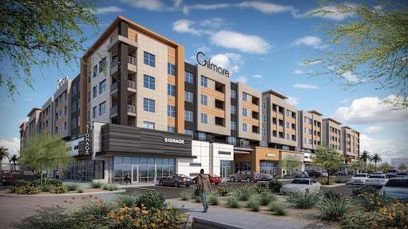 A modern apartment complex with the name Gilmore at The Residences at The Gilmore in Gilbert, AZ