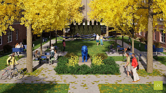 A park with people walking and sitting on the grass.