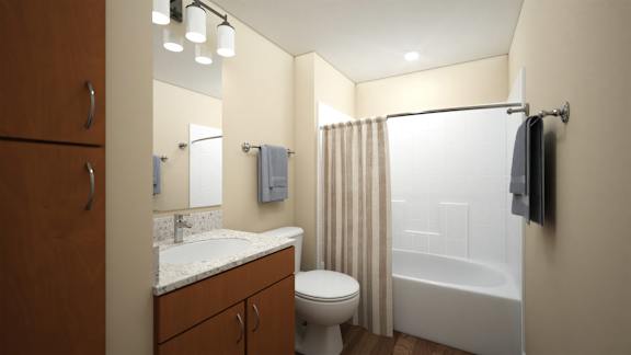 Bathroom with wood vanity and white fixtures at Turquoise Trail Apartments, Santa Fe