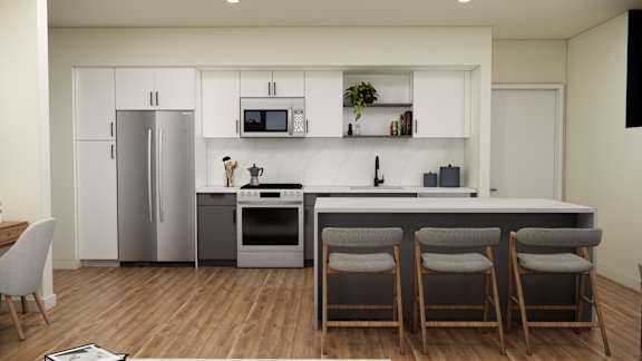 A modern kitchen with a refrigerator, microwave, oven, and bar stools.