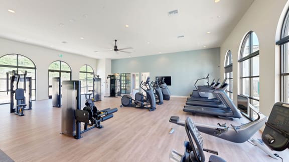 a gym with cardio machines and weights on a wooden floor at Anacapa Canyon, Camarillo, 93012
